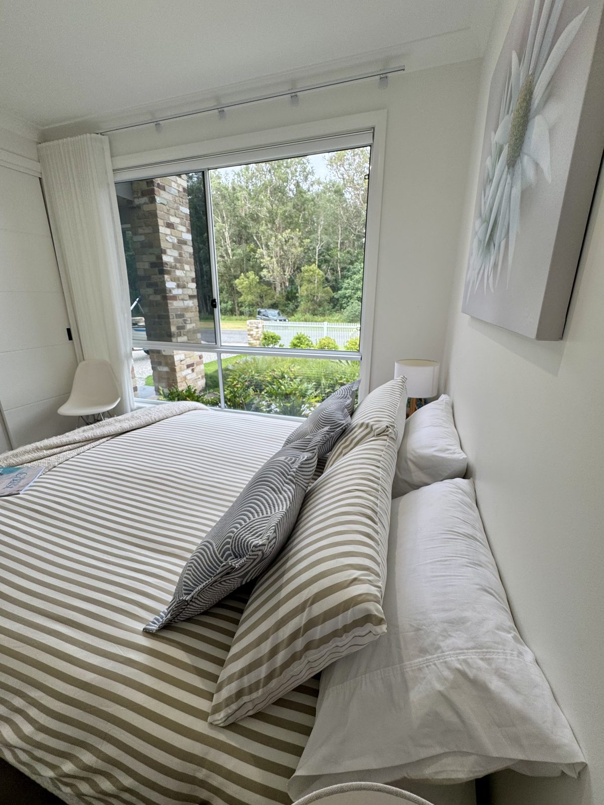 Queen bedroom with garden views at Drift, Tea Gardens