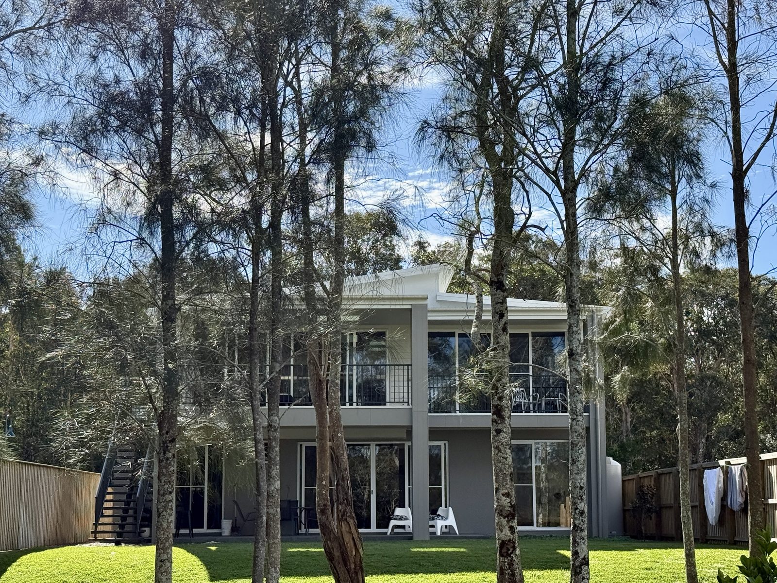 Rear of Drift holiday house viewed from the garden, showing both decks
