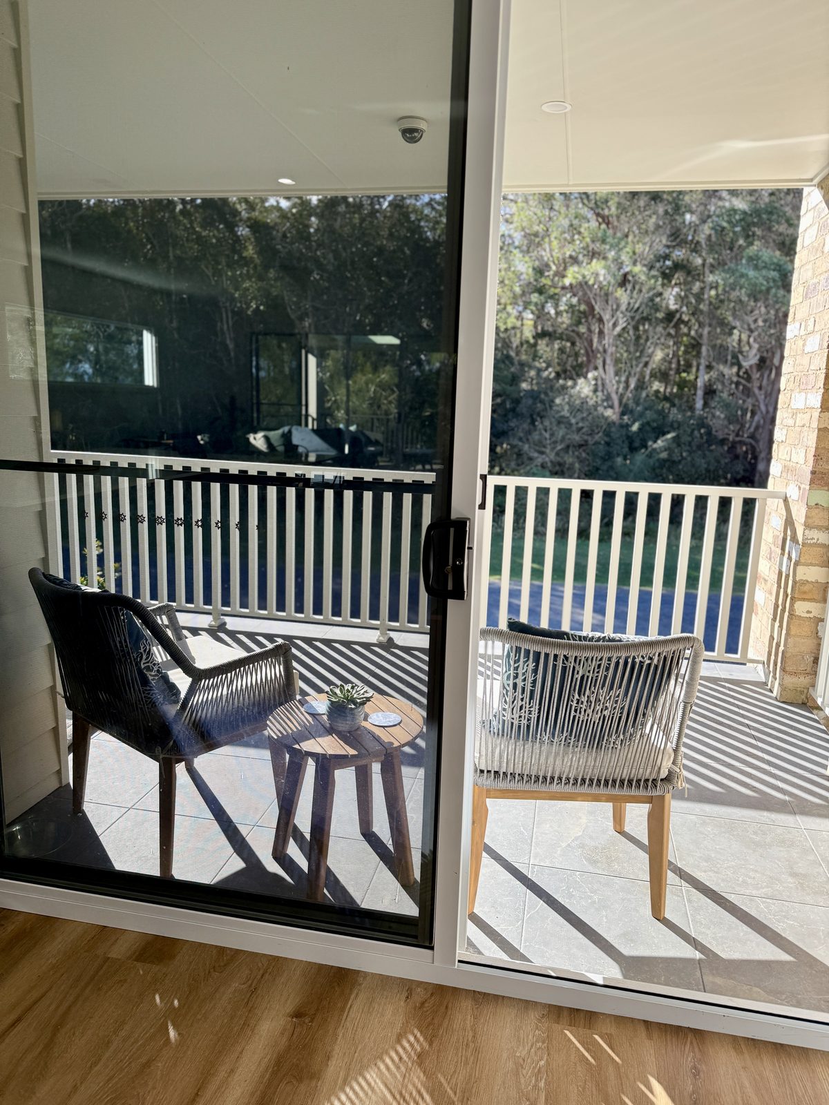 Balcony seating with bush outlook at Drift, Tea Gardens
